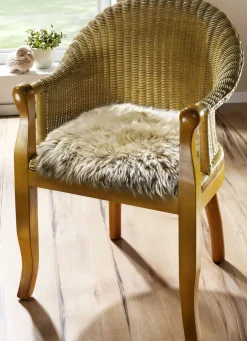 Merino-Lammfell-Sitzauflage in Tierform