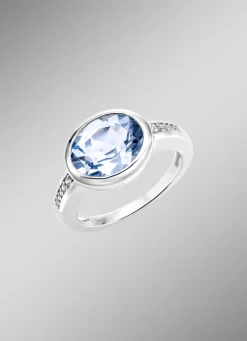 Schicker Damenring mit beh. Blautopas und synth. Zirkonia